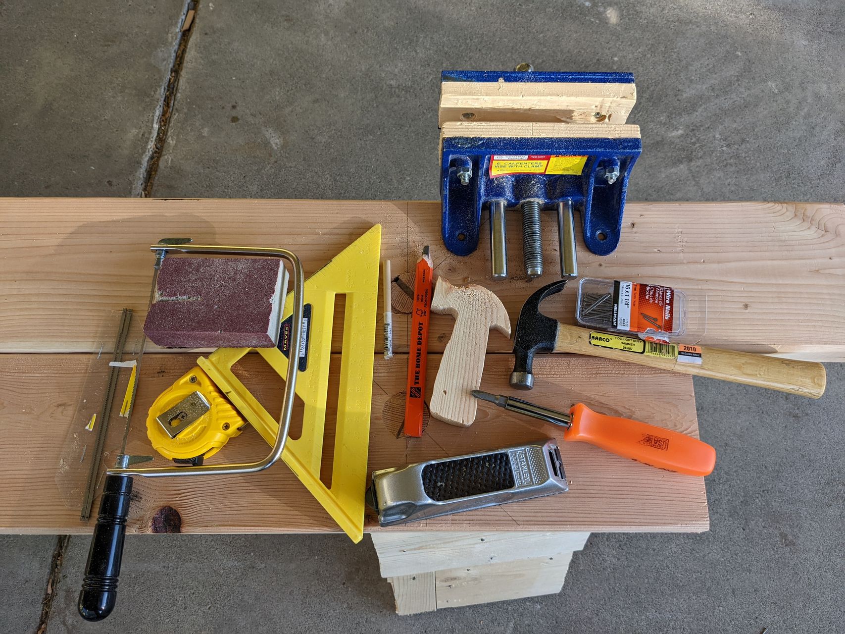 kid tools spread out on workbench